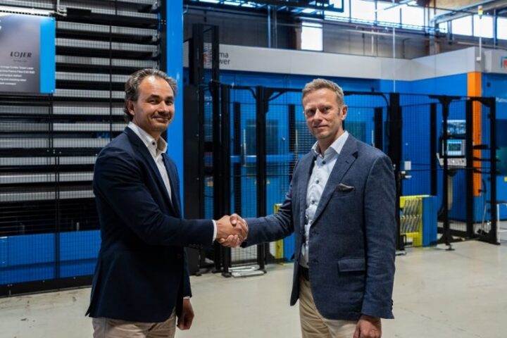 Leadership handover handshake at Lojer Group